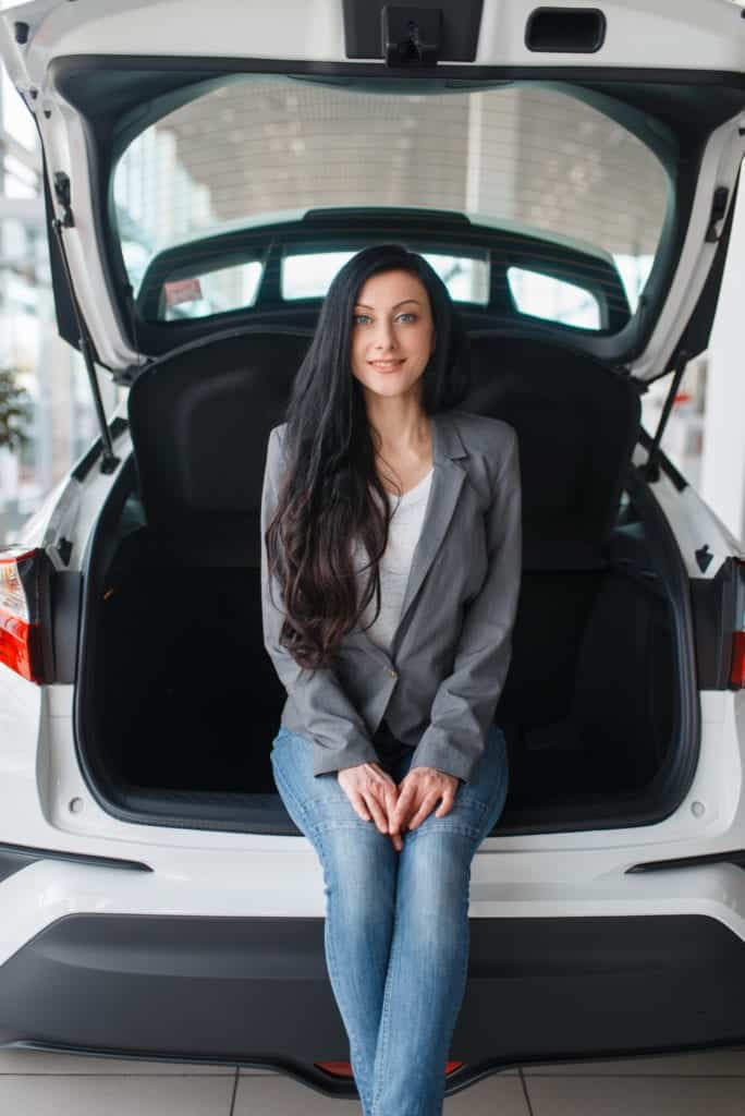woman-buying-new-car-lady-near-the-opened-trunk
